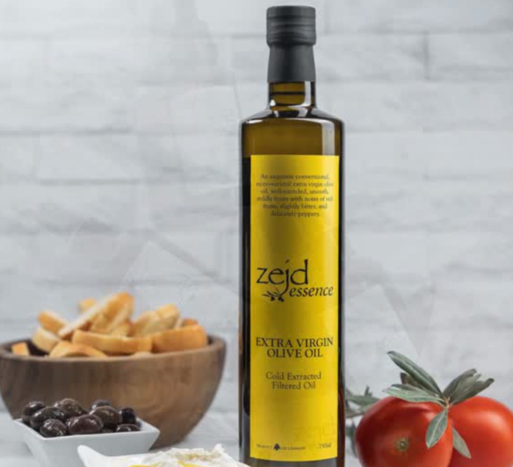 Zejd Essence extra virgin olive oil with olives, bread and tomatoes